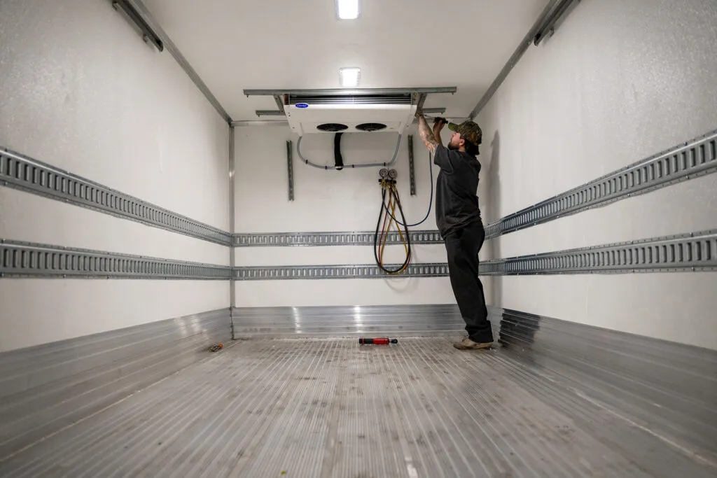 installing the cooling unit on an insulated refrigerated truck
